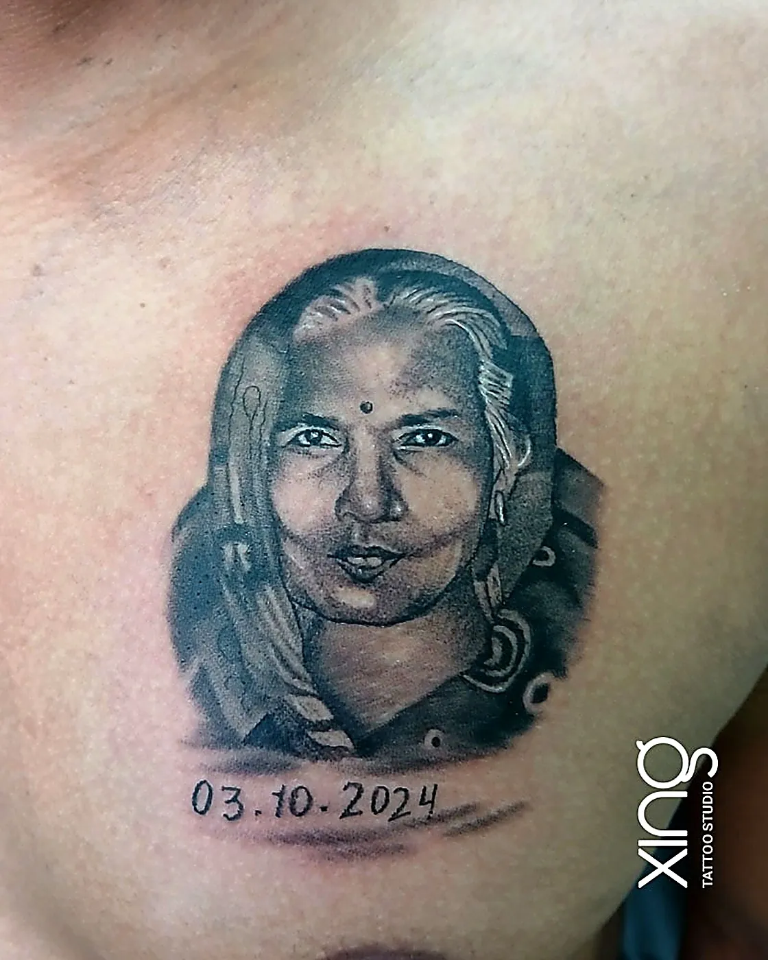 Realistic portrait tattoo of a woman on chest with fine shading detail