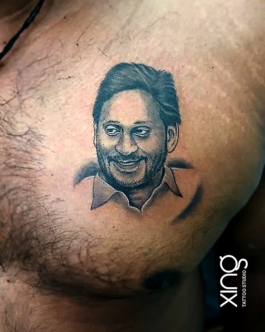 Memorial portrait tattoo of a grandmother with a keepsake date