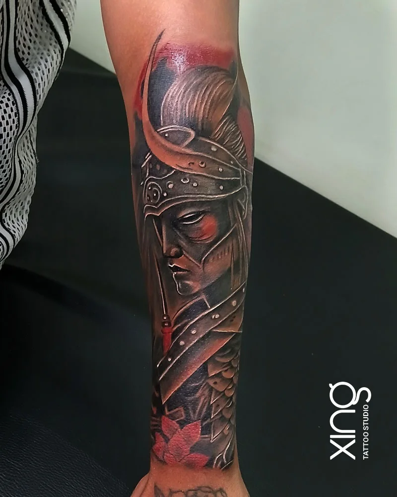 Black and grey samurai warrior forearm tattoo with red accents by XING Tattoo Studio, Brookefield, Bengaluru